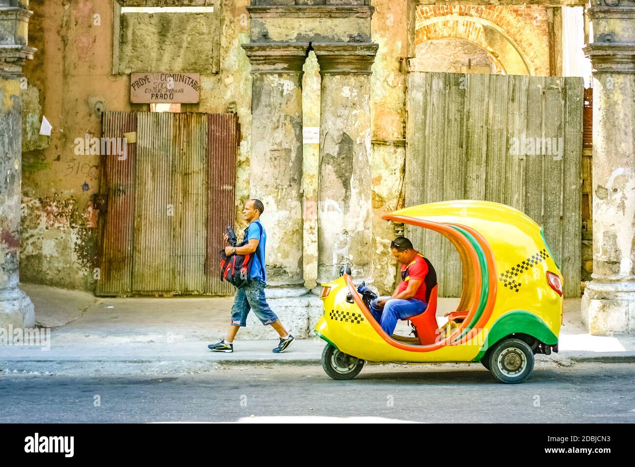 July 15, 2019 - Havana Cuba. Old retro coco taxi in Havana with tipical buidings Stock Photo