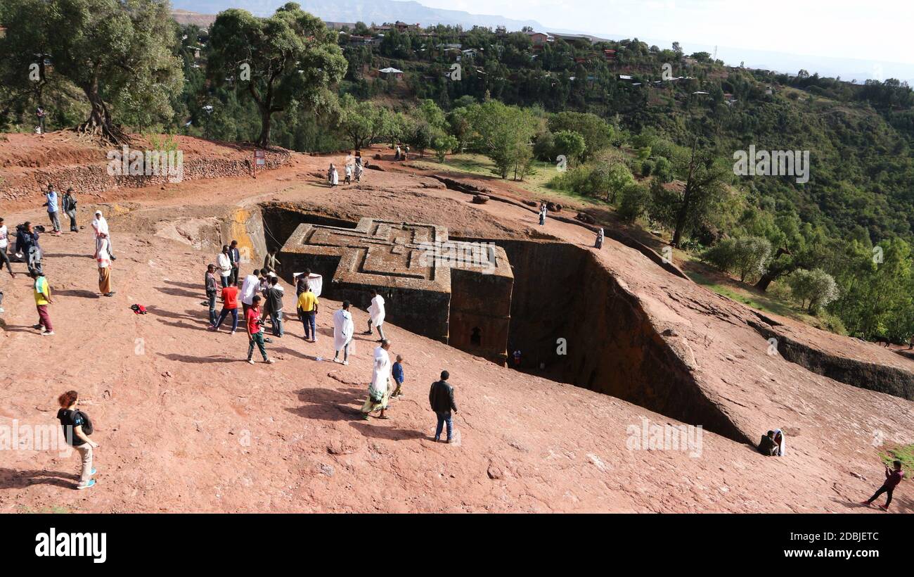 Lalibela/Ethiopia - April 12, 2019: Pilgrims visit the rock-hewn Church of St. George Stock Photo