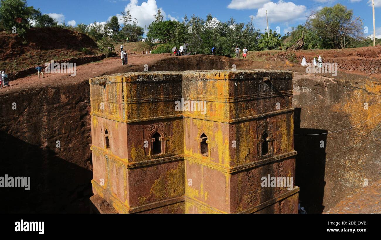 Lalibela/Ethiopia - April 12, 2019: Pilgrims visit the rock-hewn Church of St. George Stock Photo