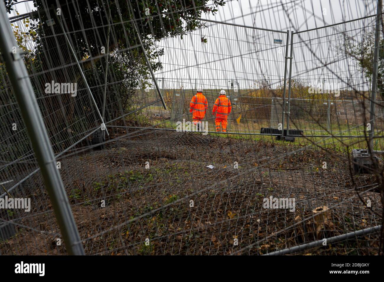 Aylesbury Vale, Buckinghamshire, UK. 17th November, 2020. HS2 security guards patrol  badger setts near Jones Hill Wood that HS2 Ltd have fenced over and put one way doors on them so that badgers inside can leave but never return. Badgers use the same setts for many generations and now many badgers will have to find new homes and risk being run over on nearby main roads. The controversial and over budget HS2 High Speed Rail puts 108 ancient woodlands, 33 SSSIs and 693 wildlife sites at risk. Environmental campaigners are calling for the destructive scheme to be cancelled. Credit: Maureen McLea Stock Photo