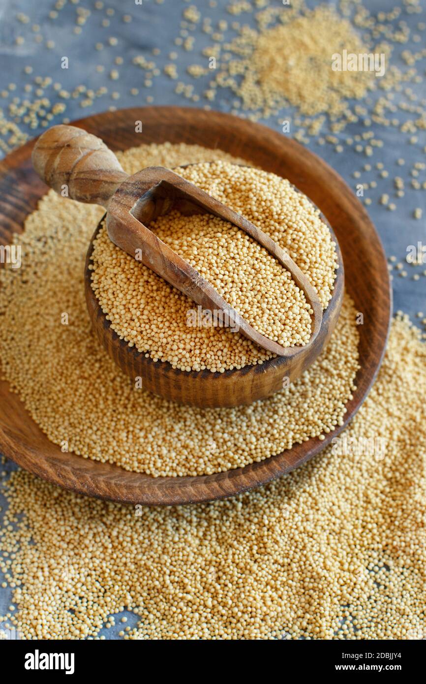 bowl of raw Amaranth Grain with a scoop close up Stock Photo