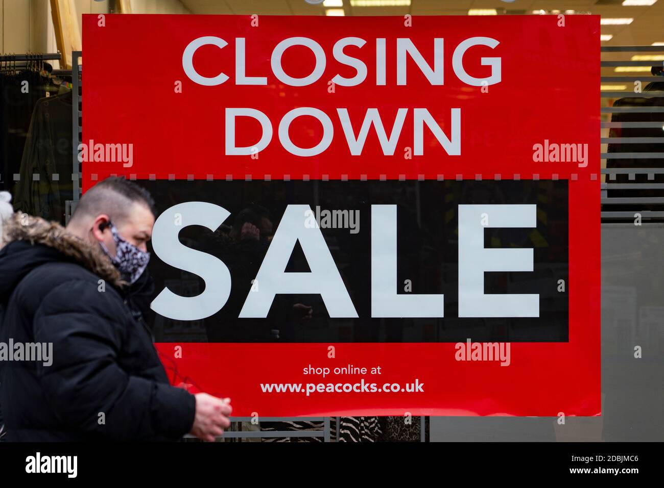 Motherwell, Scotland, UK. 1 November 2020. The Scottish Government today announced that from Friday 20 November, the most severe level 4 lockdown will be introduced in eleven Scottish council areas. This means non essential shops will close and bars, restaurants and cafes. Pictured; Closing down sale sign in Peacocks shop on shopping arcade.    Iain Masterton/Alamy Live News Stock Photo