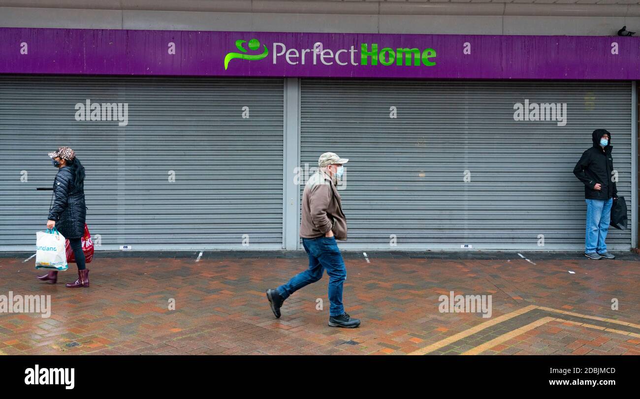 Motherwell, Scotland, UK. 1 November 2020. The Scottish Government today announced that from Friday 20 November, the most severe level 4 lockdown will be introduced in eleven Scottish council areas. This means non essential shops will close and bars, restaurants and cafes. Pictured; Closed shop on shopping arcade.    Iain Masterton/Alamy Live News Stock Photo