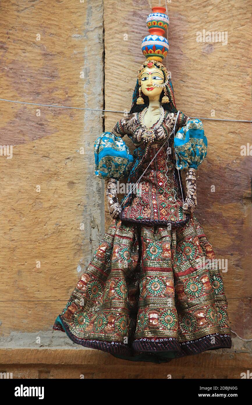 Rajasthani doll in colorful attire bearing pots on head dispalyed at Patawon-ki-Haweli in Jaisalmer Fort, Jaisalmer, Rajasthan, India, Asia Stock Photo