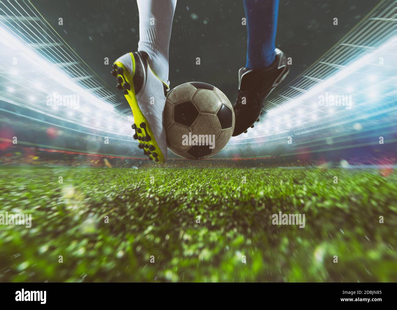 Game contrast between two soccer players trying to kick the ball Stock