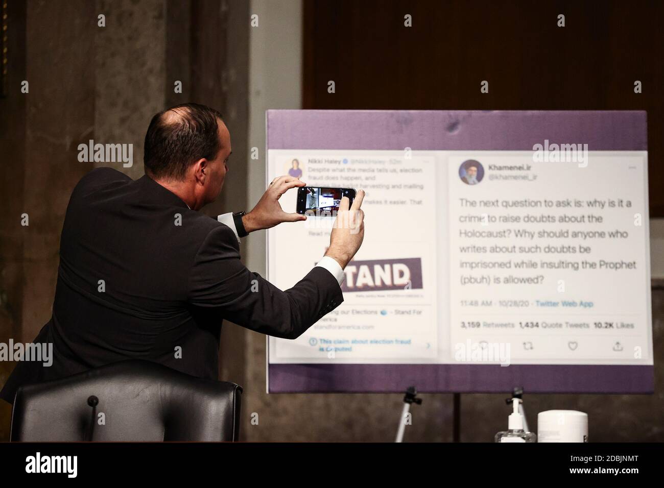Washington, USA. 17th Nov, 2020. U.S. Senator Mike Lee (R-UT) photographs a display at a Senate Judiciary Committee hearing titled, 'Breaking the News: Censorship, Suppression, and the 2020 Election,” on Facebook and Twitter's content moderation practices, on Capitol Hill in Washington, U.S., November 17, 2020. REUTERS/Hannah McKay/Pool Credit: Sipa USA/Alamy Live News Stock Photo