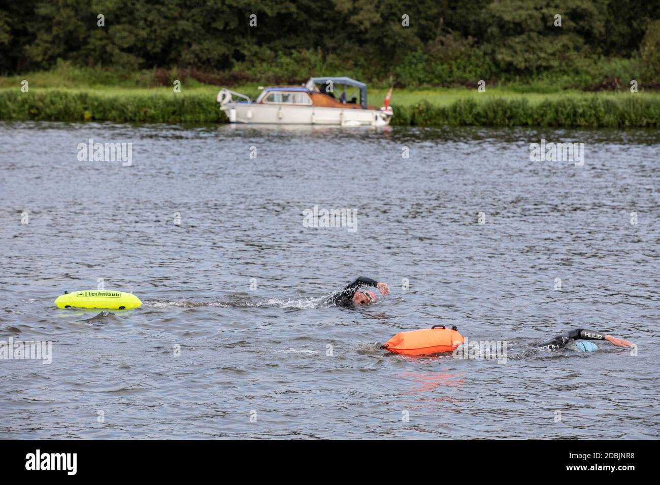 Swimmers take part in the annual Henley Swimming Festival where they swim in the River Thames in the ‘Henley Classic’ and varied lengths of miles. Stock Photo