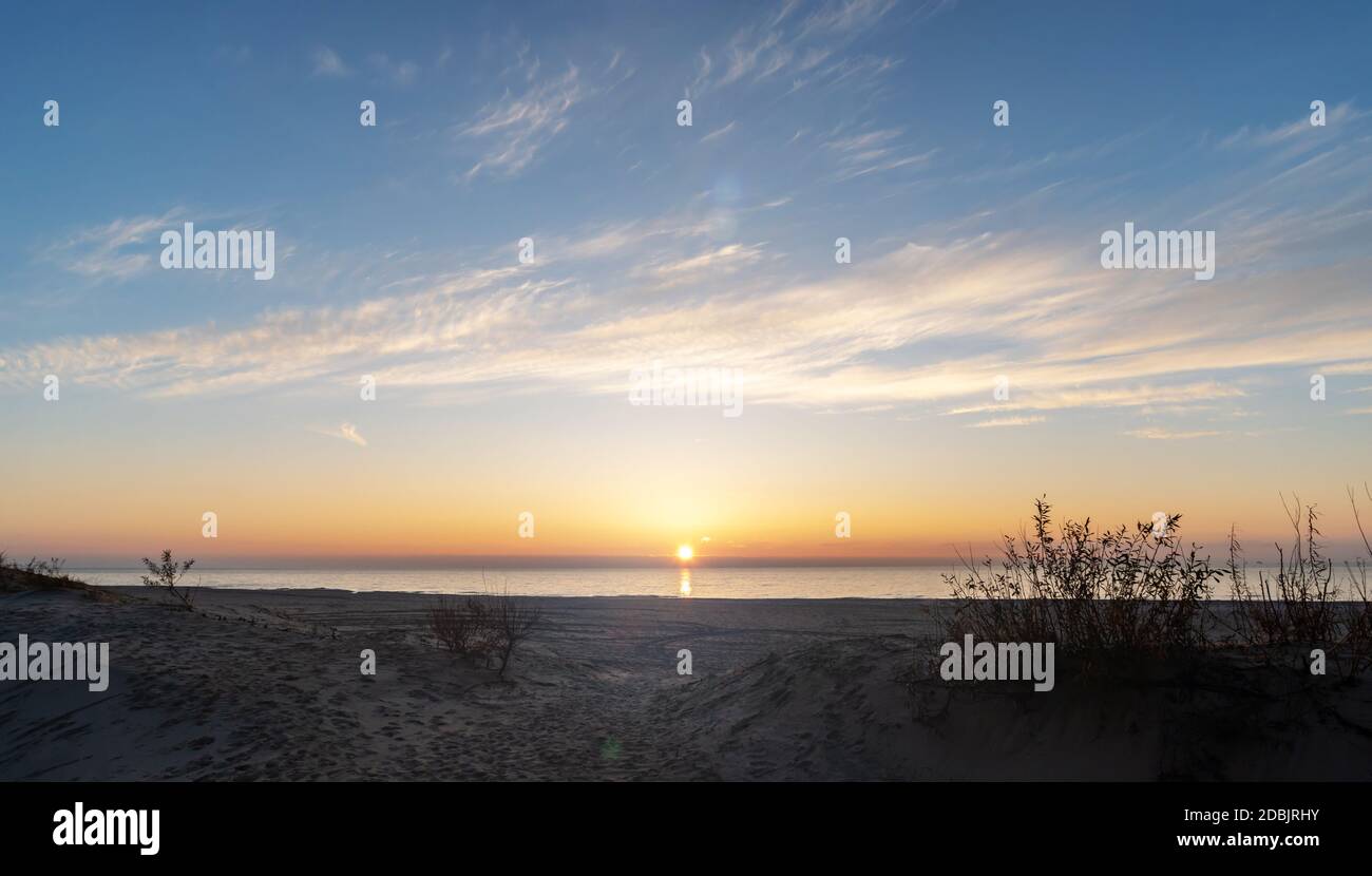 Russia, Yantarny village in the Kaliningrad region, sandy beach at sunset. Stock Photo
