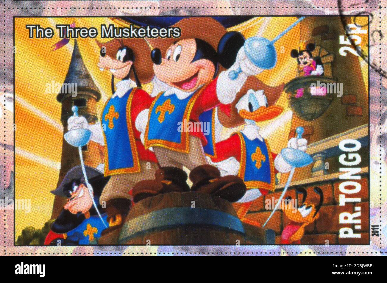 TONGO - CIRCA 2011: stamp printed by Tongo, shows Walt Disney cartoon character, The three musketeers, circa 2011 Stock Photo
