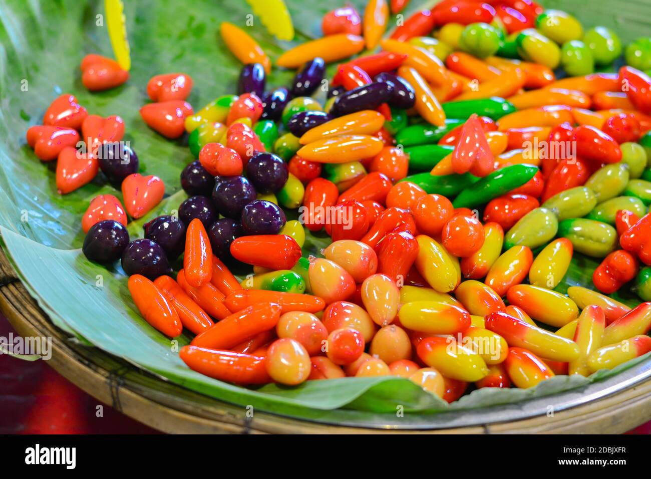 (Look Chup) made from mung bean paste, coconut milk, sugar and coating with gelatin, (Marzipan) Famous Thai desserts, colorful fruit, Fresh made Thai Stock Photo