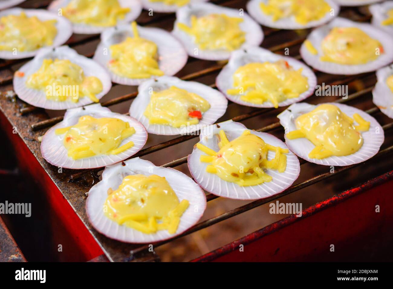 BBQ grilled scallops on fire, grilled scallops with butter and cheese