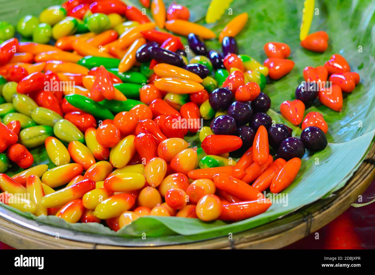(Look Chup) made from mung bean paste, coconut milk, sugar and coating with gelatin, (Marzipan) Famous Thai desserts, colorful fruit, Fresh made Thai Stock Photo