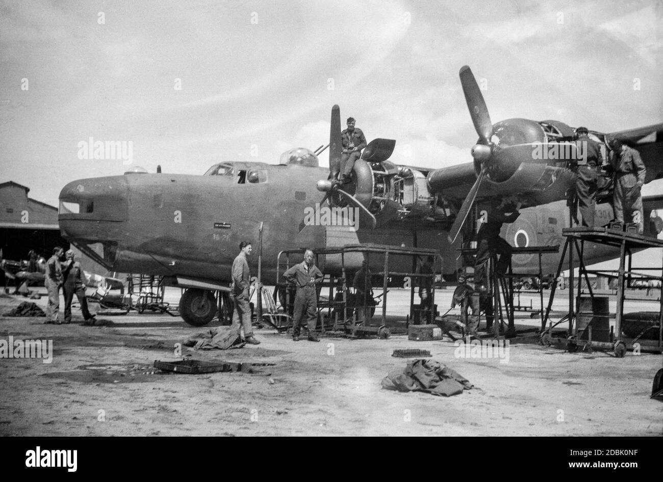 Royal Air Force Consolidated Liberator bomber transport aircraft undergoing maintenance at RAF El-Adem in Libya 1945. Now know as Gamal Abdel Nasser Airbase. Stock Photo
