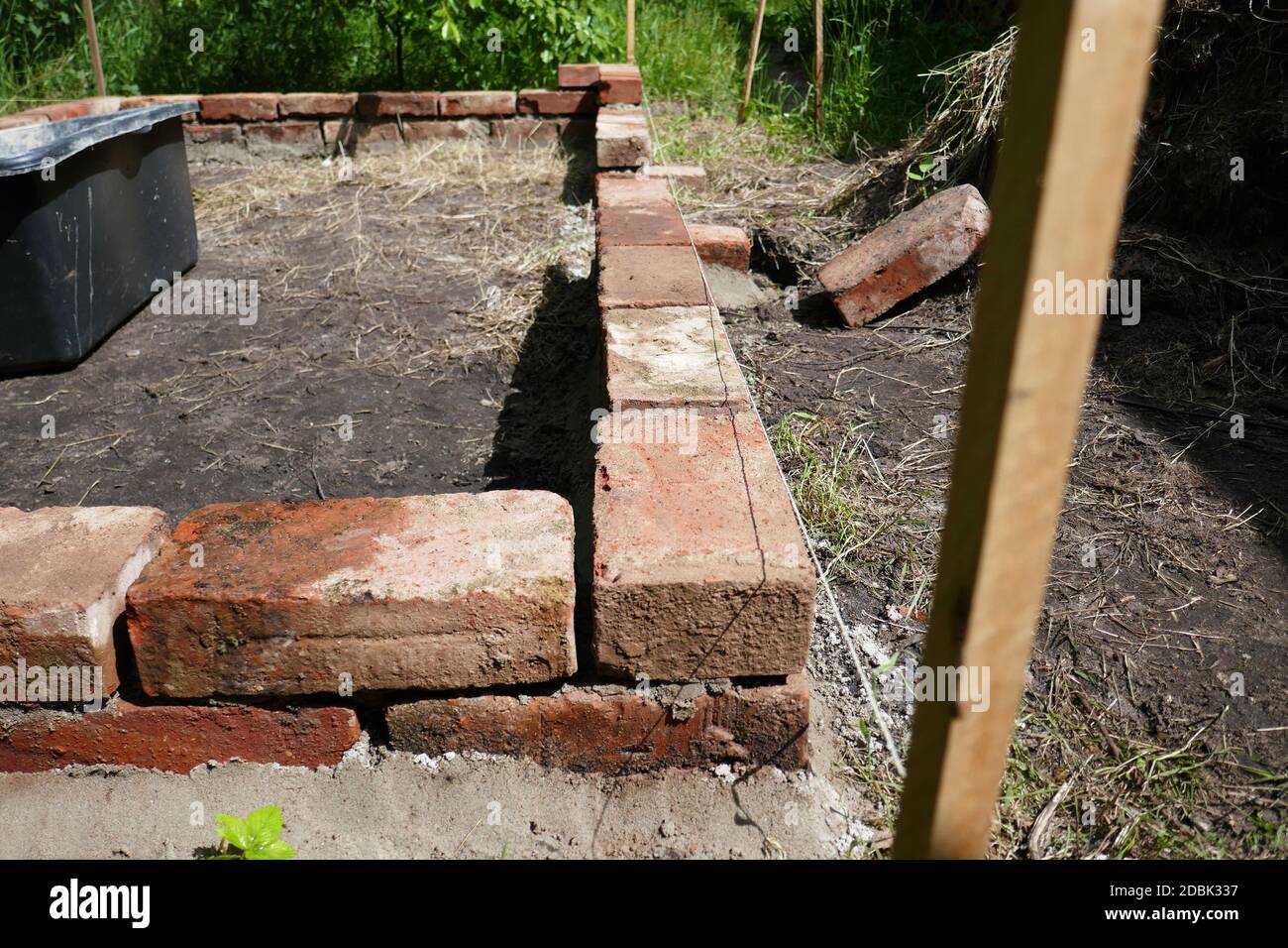 Raised bed made of bricks Stock Photo Alamy