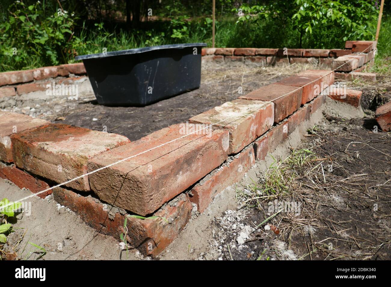 Raised bed made of bricks Stock Photo Alamy