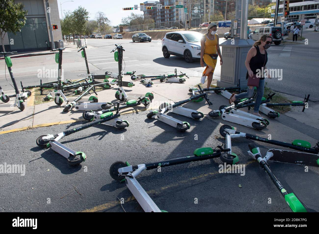 Scooters litter the corners of East Cesar Chavez and Red River Street on a Sunday morning in