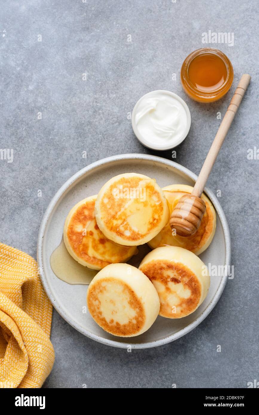 Cheesecakes, Curd cheese fritters or Syrniki. Traditional Russian ...