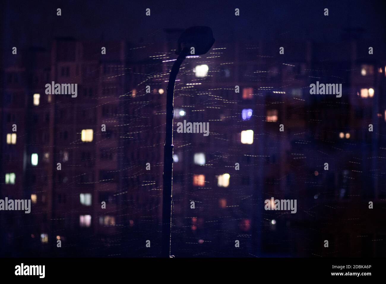 View From The Window At Night Light In The Windows Of Apartments A Burning Lantern Wet Snow Stock Photo Alamy