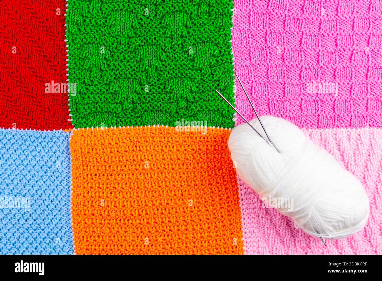 Knitted background. Knitted texture. A sample of knitting from wool ...