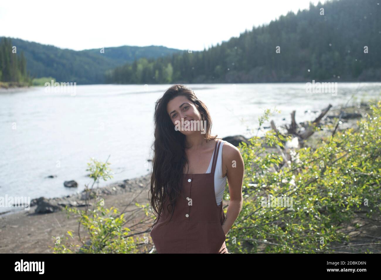 Portrait of woman standing on riverbank, Yukon, Canada Stock Photo - Alamy