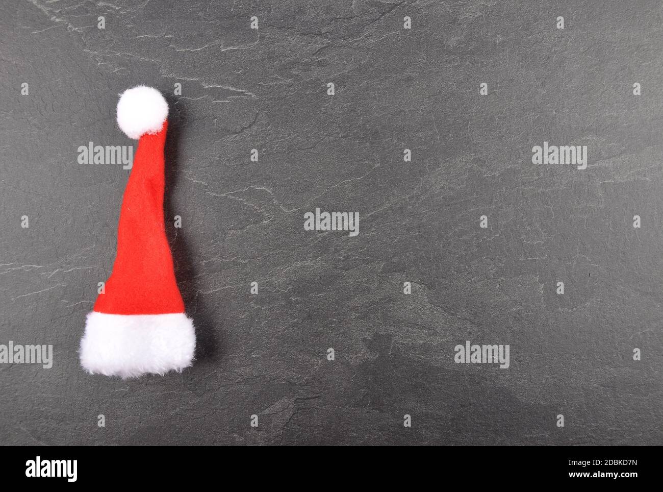 Santa hat on slate background Stock Photo