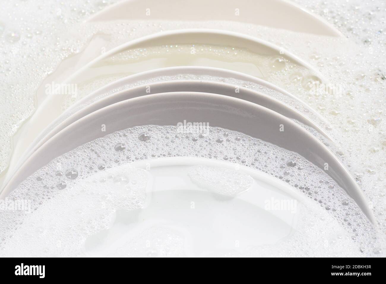 Dish washing, Dirty dishes soaking in kitchen sink Stock Photo Alamy