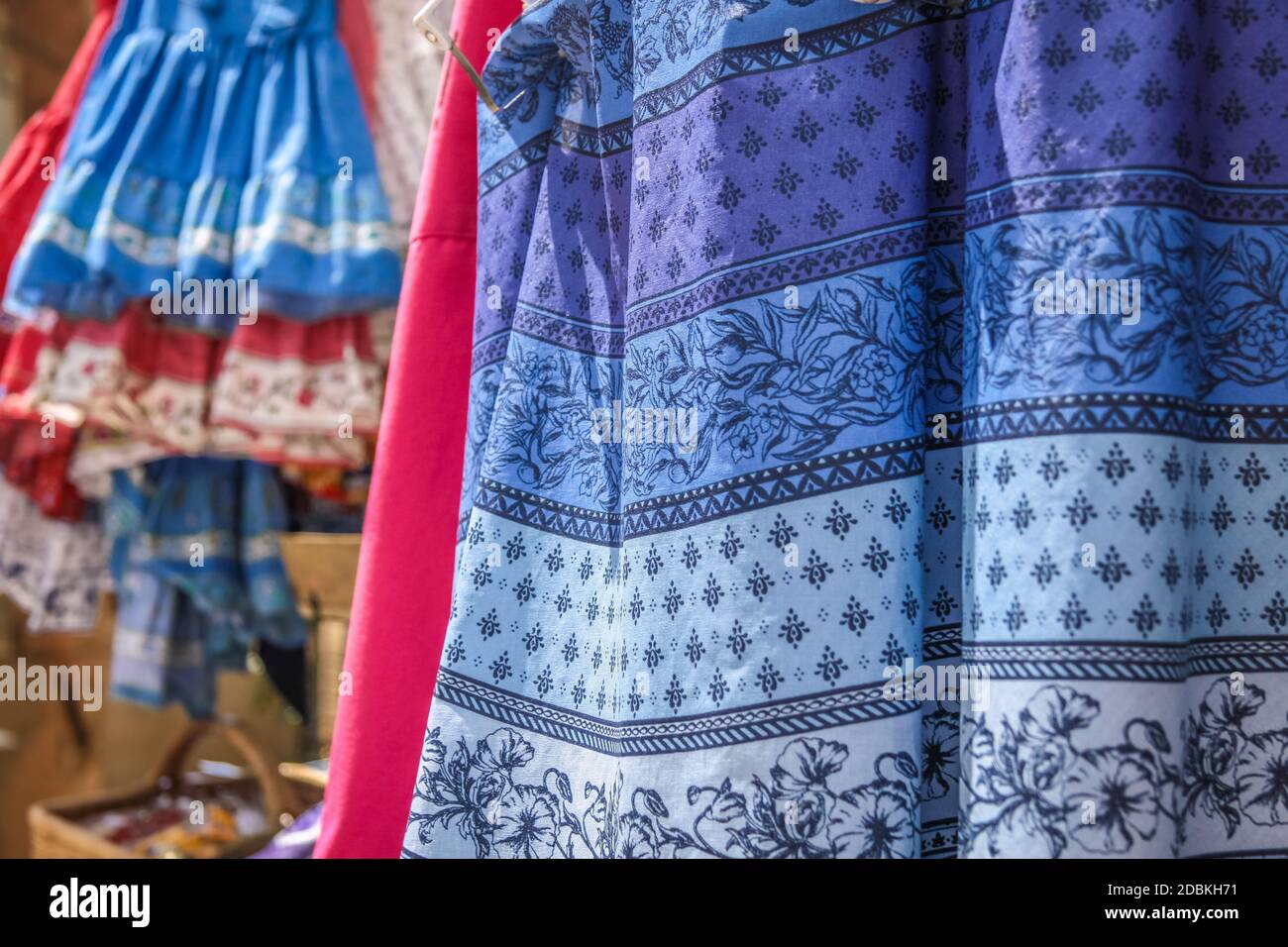 Provencal fabrics on the market in Gordes, Provence, France Stock Photo