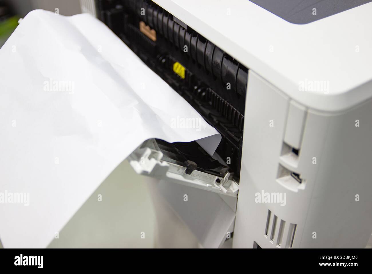 Paper A4 Stuck In Printer At Office, concept repair printer Stock Photo