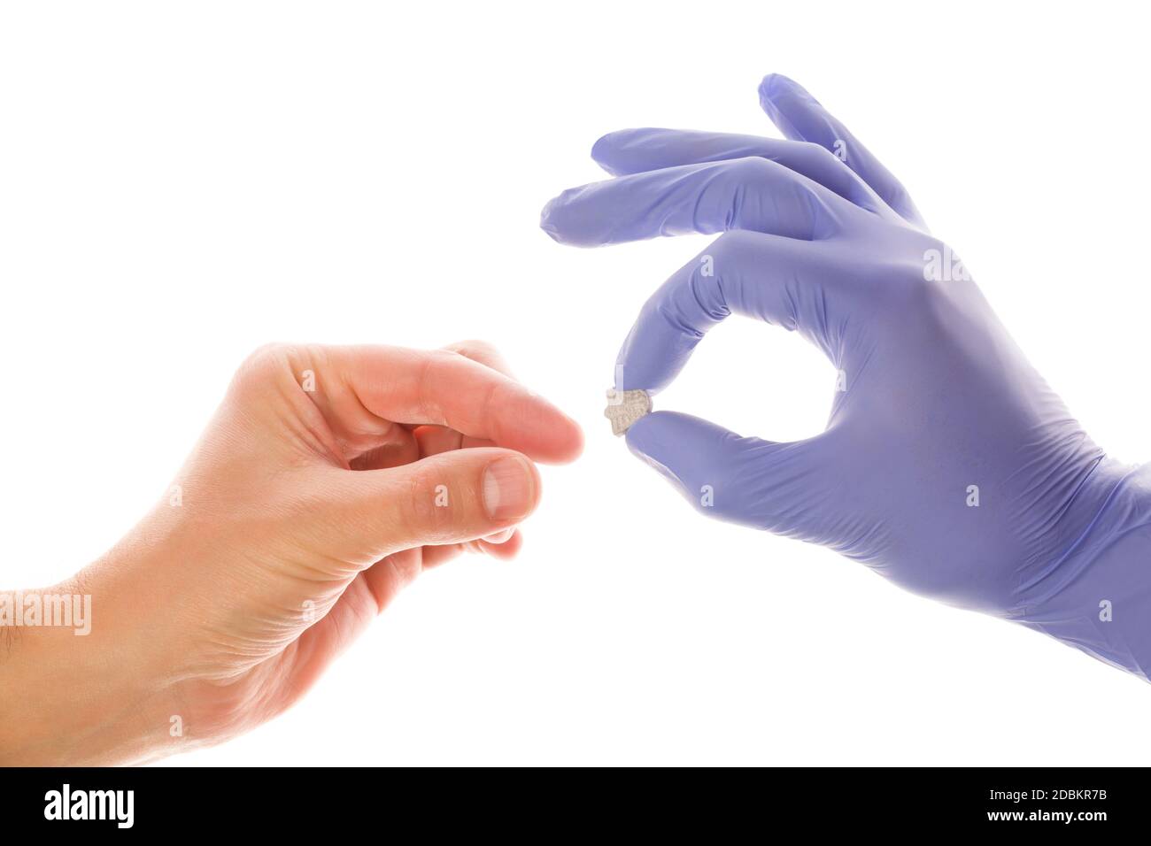 Doctor handing ecstacy pill to patiant. MDMA therapeutical use. Stock Photo