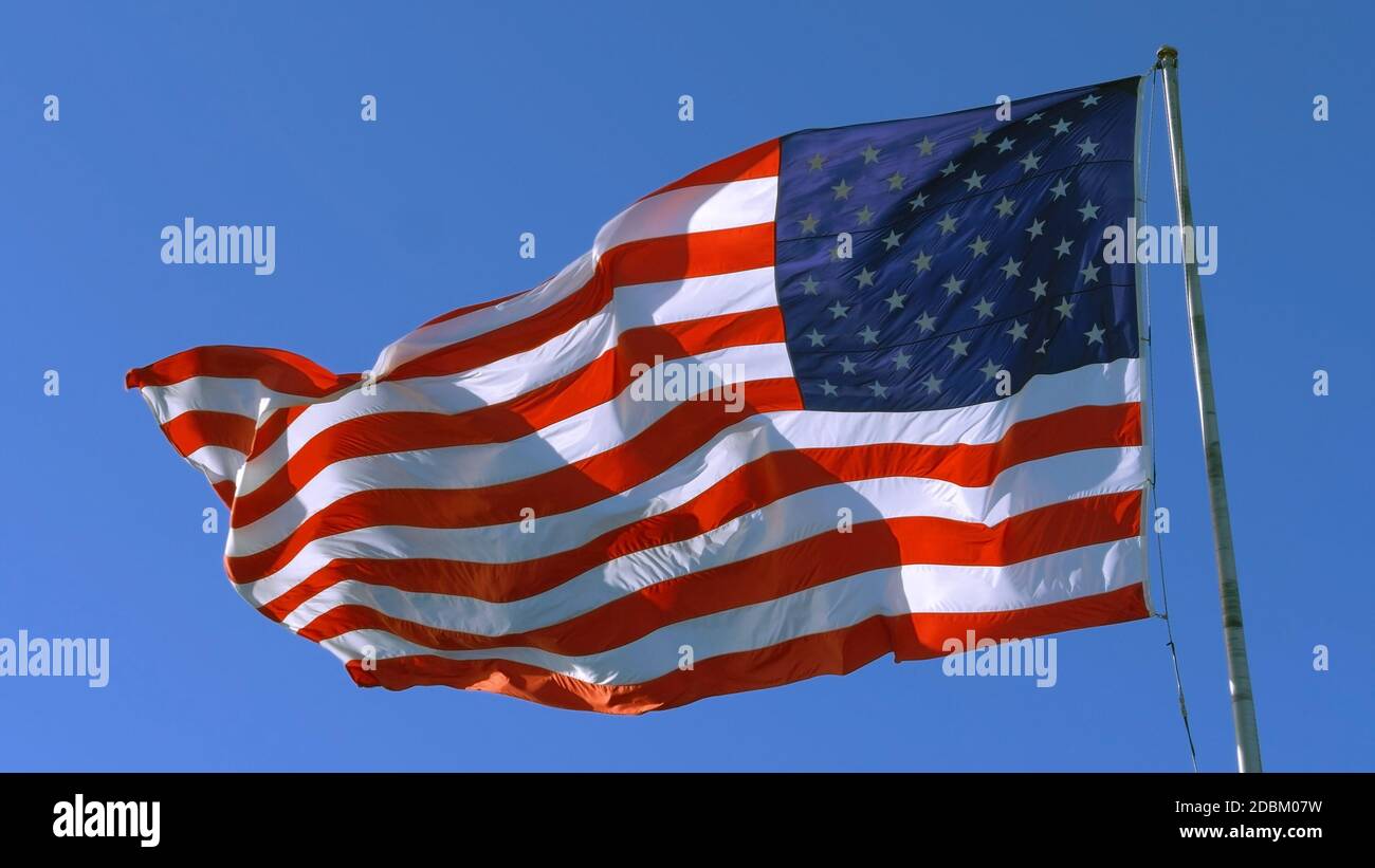 USA flag on flagpole. American flag - symbol of freedom and law in the ...