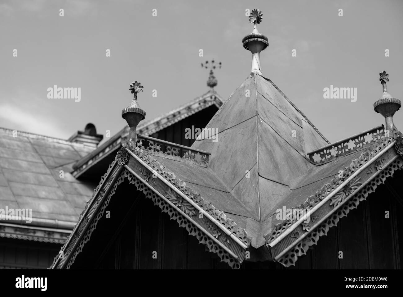 Decorated metal roof. Tin roof with ornaments. Traditional house in