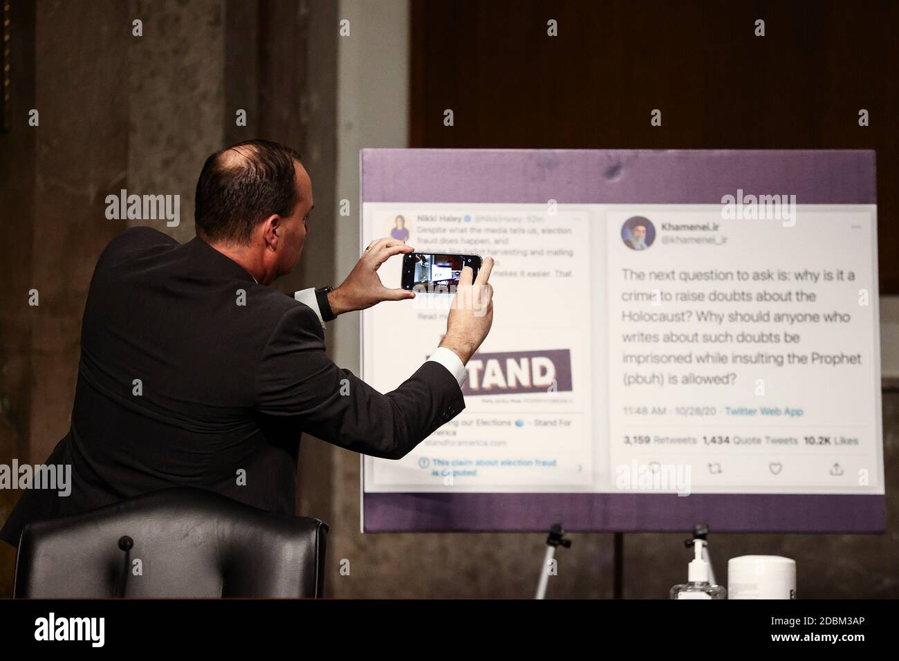 United States Senator Mike Lee (Republican of Utah) photographs a display at a US Senate Judiciary Committee hearing titled, 'Breaking the News: Censorship, Suppression, and the 2020 Election,” on Facebook and Twitter's content moderation practices, on Capitol Hill in Washington, U.S., November 17, 2020. Credit: Hannah McKay/Pool via CNP /MediaPunch Stock Photo