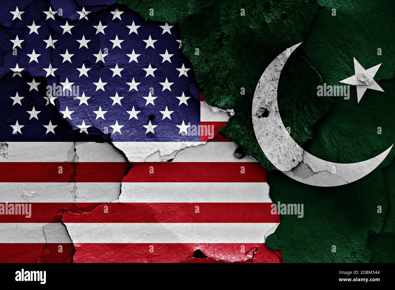 flags of USA and Pakistan painted on cracked wall Stock Photo