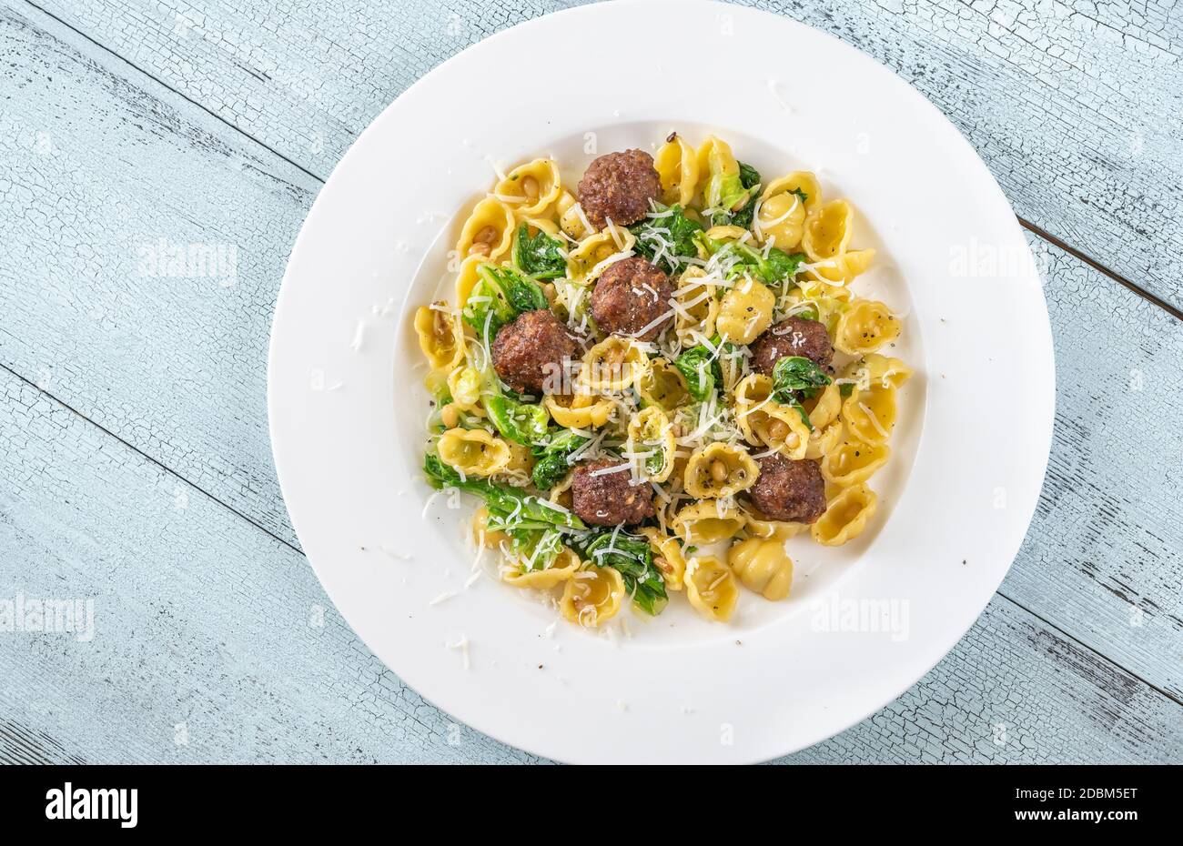Beef meatballs with pasta, kale and pine nuts Stock Photo Alamy