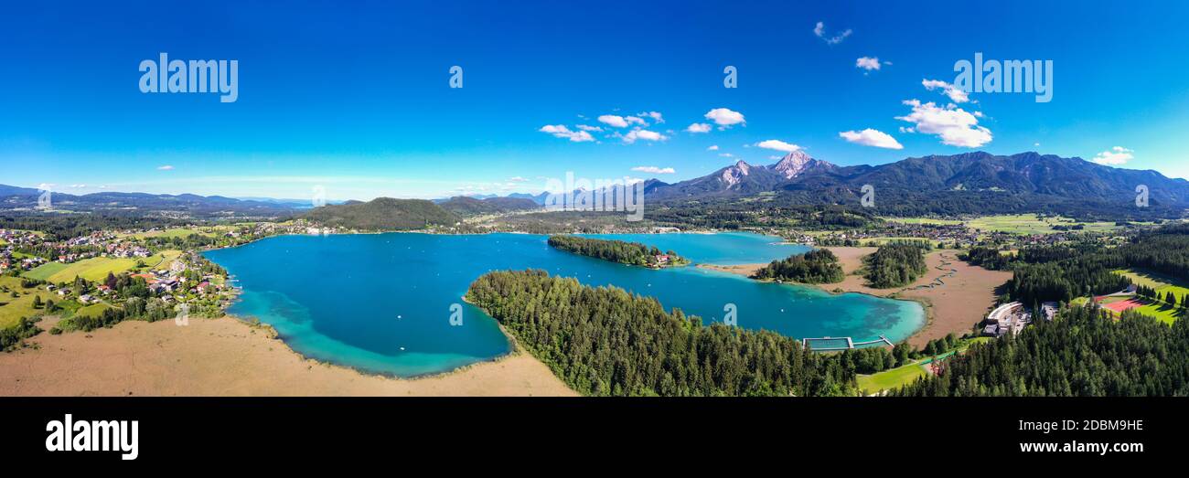 Faaker See in Carinthia. Aerial view to the beautiful lake and the Mittagskogel mountain in the south of Austria. Stock Photo