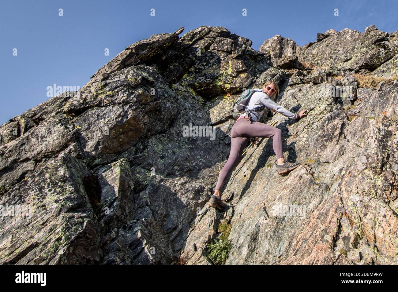 When trailrunning turns into climbing Stock Photo - Alamy