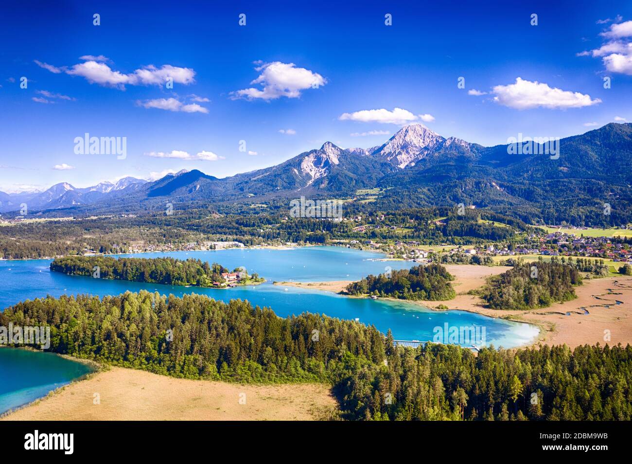 Faaker See in Carinthia. Aerial view to the beautiful lake and the Mittagskogel mountain in the south of Austria. Stock Photo