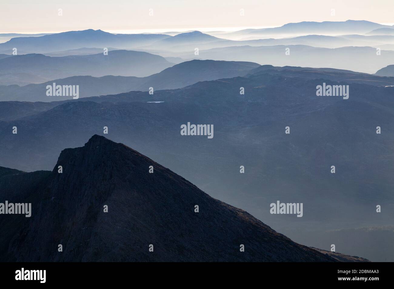 Snowdonia mountains in haze from the summit of Snowdon, North Wales Stock Photo