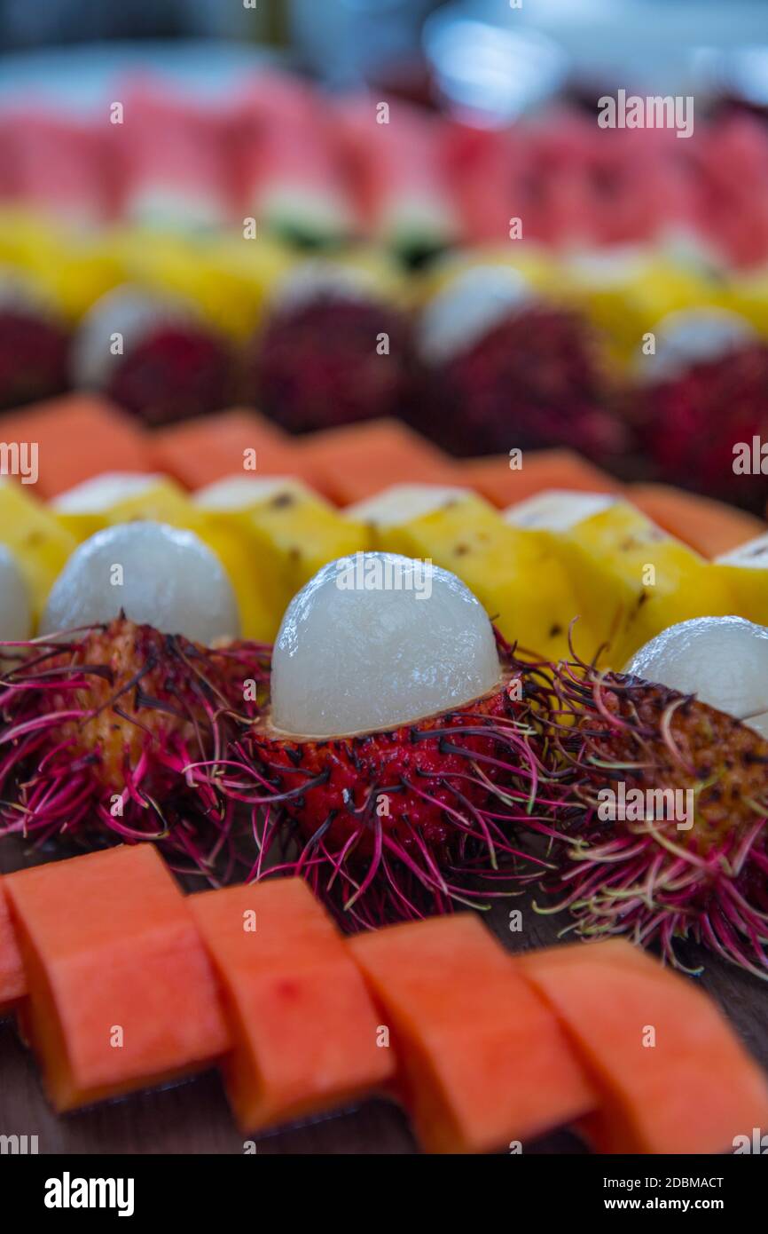 Rows of various tropical fruits, Maldives Stock Photo