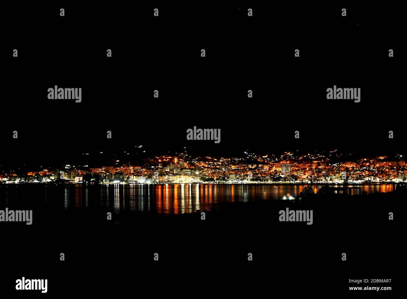 Night lights of Saranda, Albania. It is famous vacation place on Ionian Sea near Corfu Stock Photo