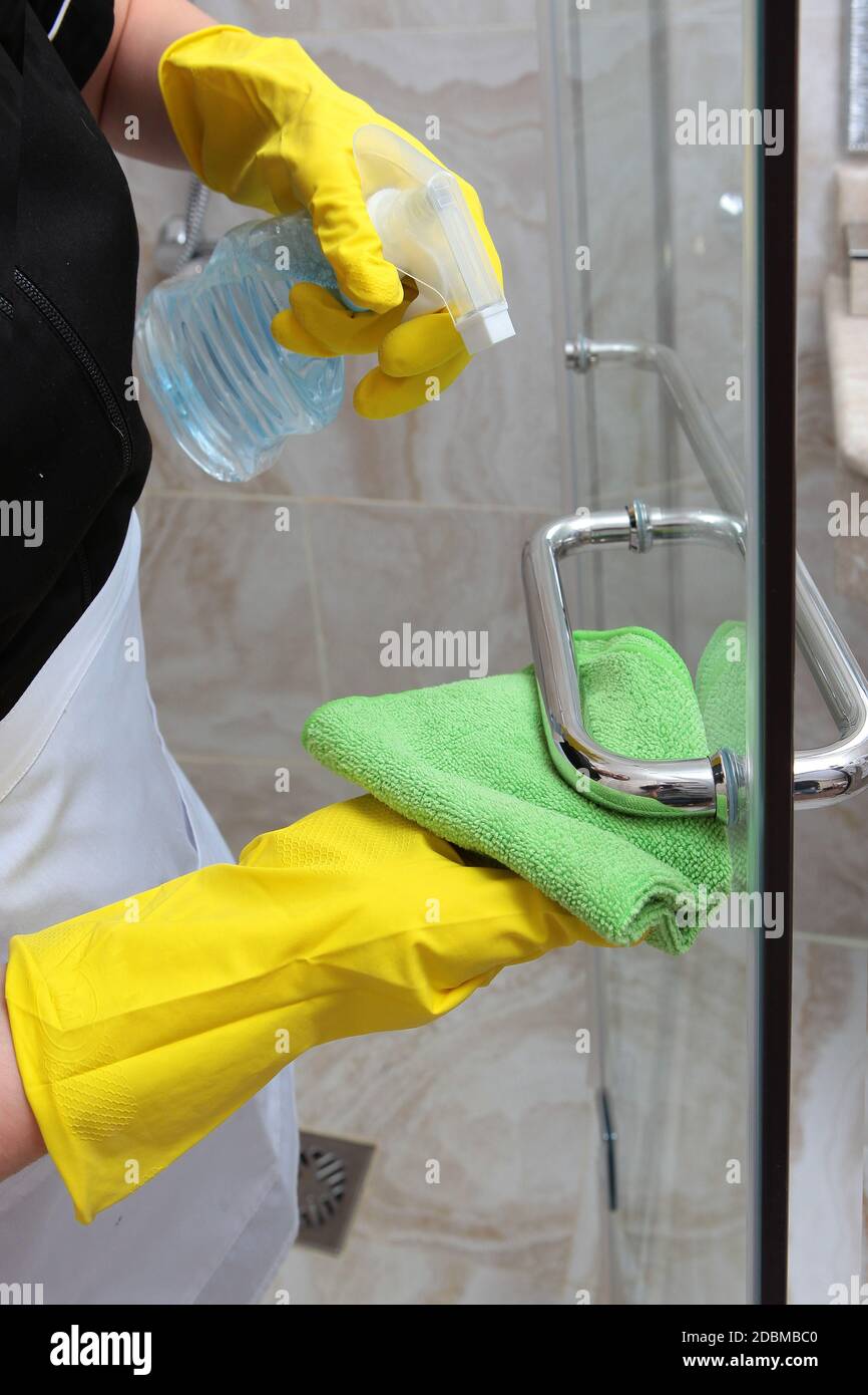 Cleaning the shower cabin. Macro photo. An unrecognizable photo. The