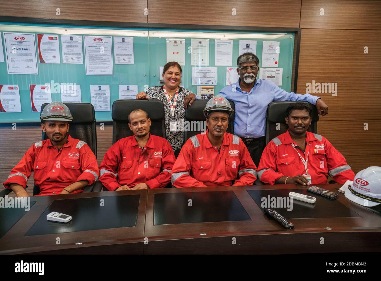 Major Ramasamy Menon and his wife Vejaletchimie Chinnayah at the board room of VG Metal Technology Sdn Bhd with their favourite workers. Malaysia. Stock Photo
