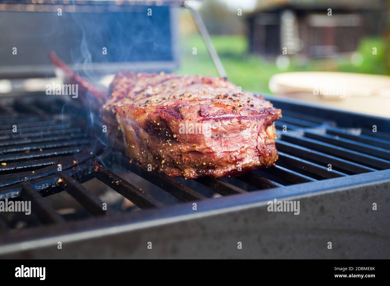 Dry Aged Barbecue Tomahawk Steak on grill Stock Photo Alamy