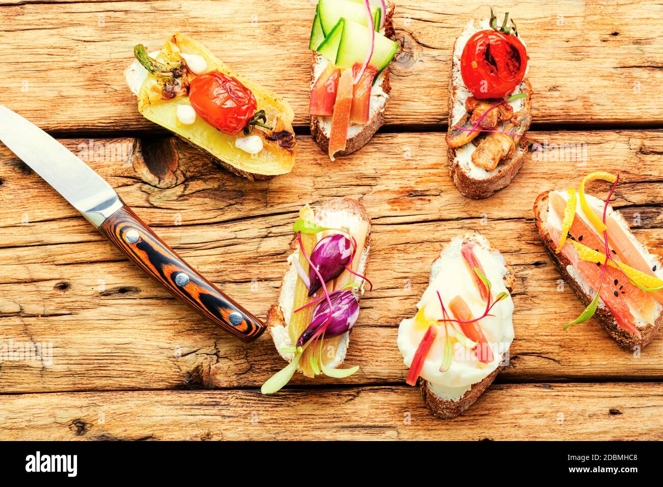Set of delicious Italian bruschettas with grilled vegetables. Stock Photo