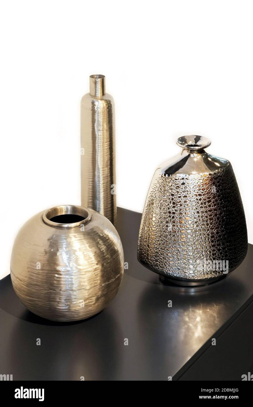 Three silver metal vases in different shapes Stock Photo