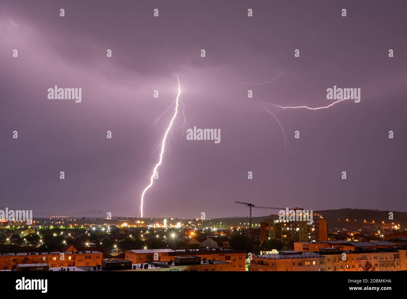 Storm Clouds and Lightning Bolts Above The City Stock Photo - Alamy