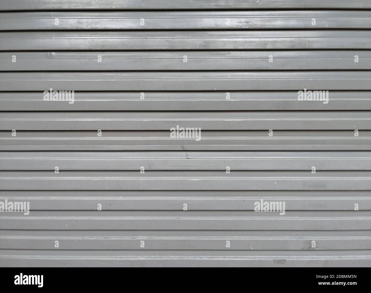 Perforated metal garage door texture background Stock Photo Alamy