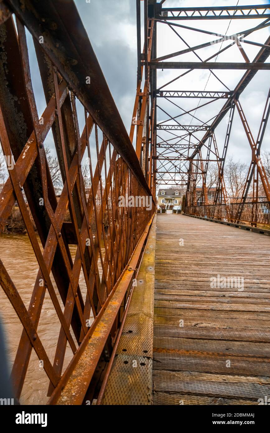 old bridge in rusty metal structure and wooden floor of SaintPie
