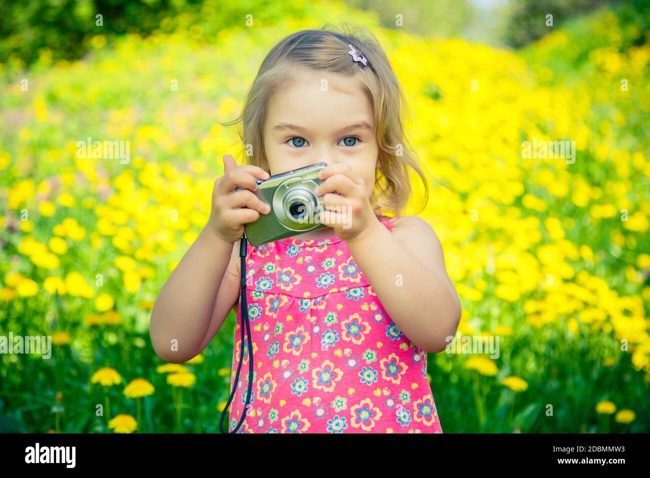 Little girl taking pictures with point and shoot camera Stock Photo Alamy