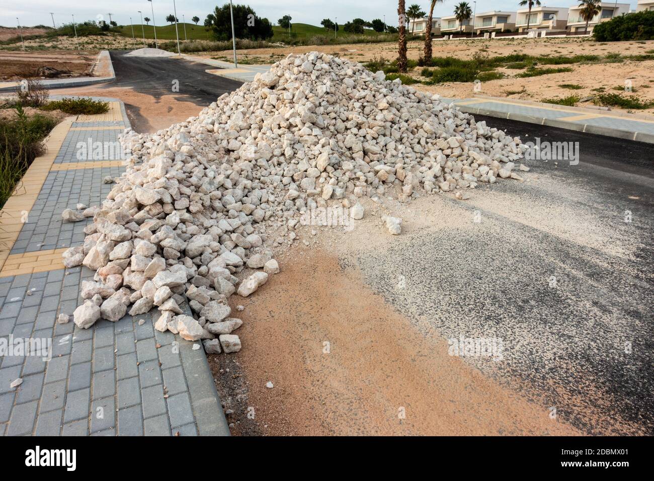 pile of rubble at side of road on spanish urbanisation Stock Photo Alamy